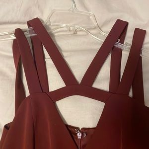 Fitted maroon jump suit